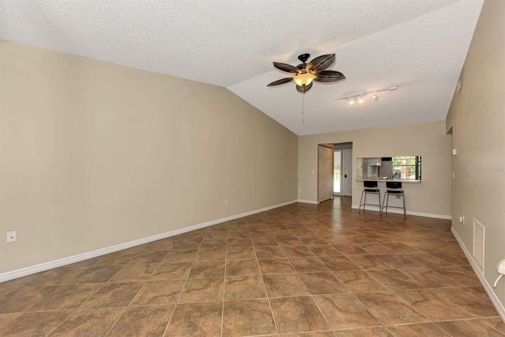 5645 Summerside Lane, Unit 40B Sarasota, FL 34231 - Photo 4 of 23 a view of a livingroom with a table and workspace