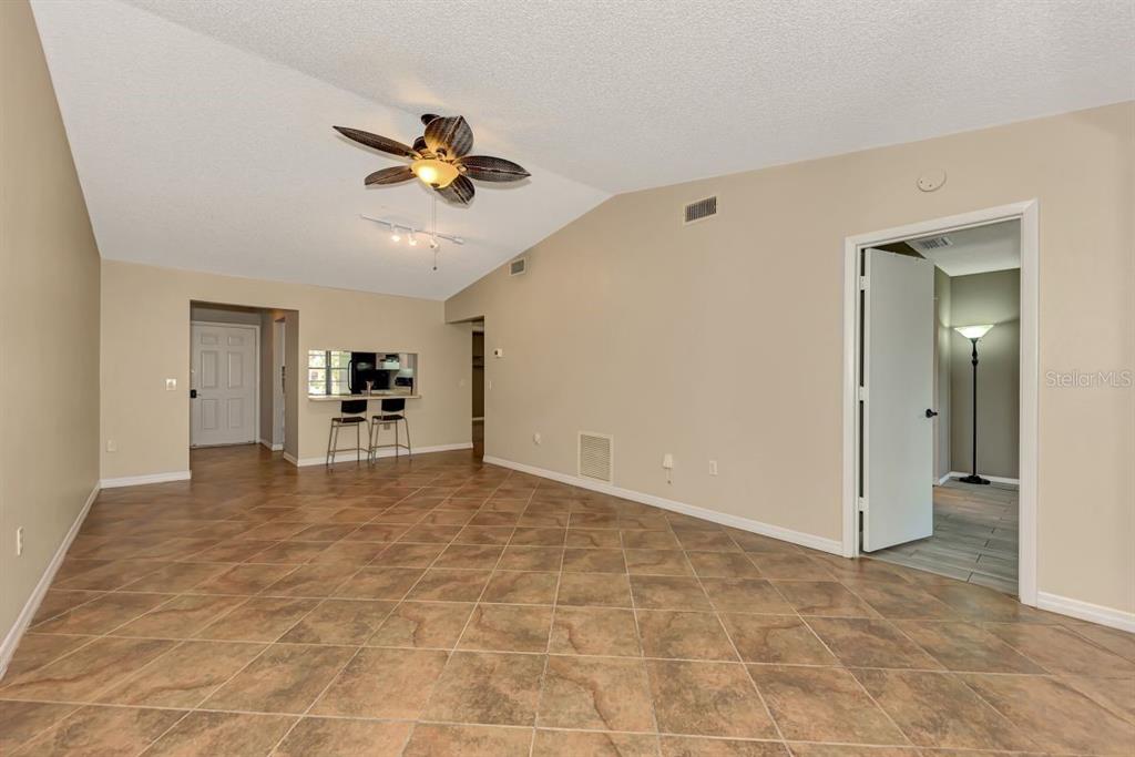 5645 Summerside Lane, Unit 40B Sarasota, FL 34231 - Photo 5 of 23 a view of livingroom with hardwood floor and a ceiling fan