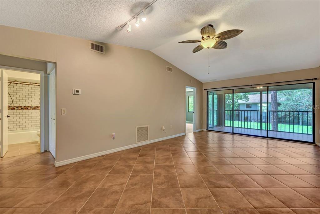 5645 Summerside Lane, Unit 40B Sarasota, FL 34231 - Photo 6 of 23 a view of an empty room with a window