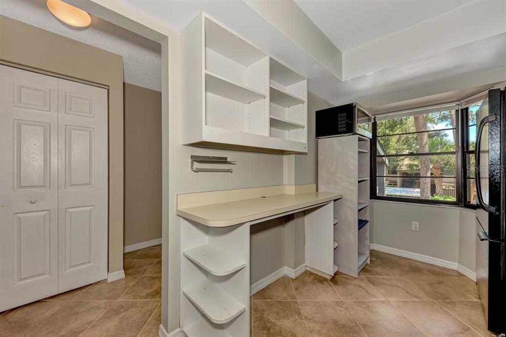 5645 Summerside Lane, Unit 40B Sarasota, FL 34231 - Photo 10 of 23 a kitchen with stainless steel appliances a sink and cabinets