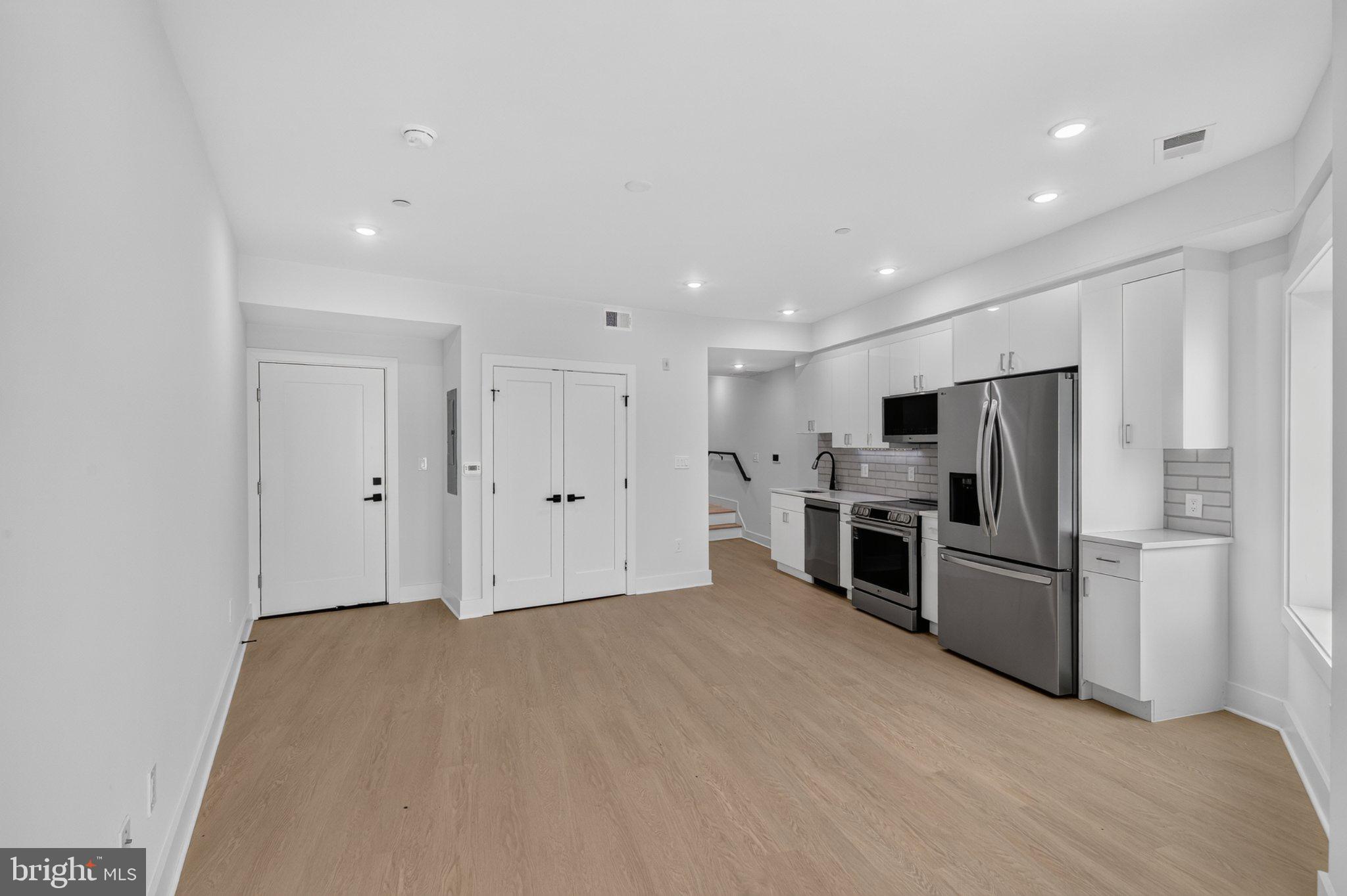 1650 Columbia Road Northwest, Unit 402 Washington, DC 20009 - Photo 3 of 19 Modern open space with sleek finishes.