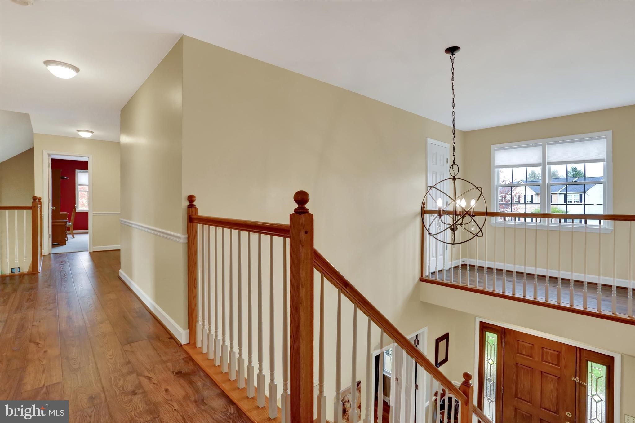 6 Virginia Avenue Sinking Spring, PA 19608 - Photo 17 of 30 a view of a hallway with the wooden floor and chandelier