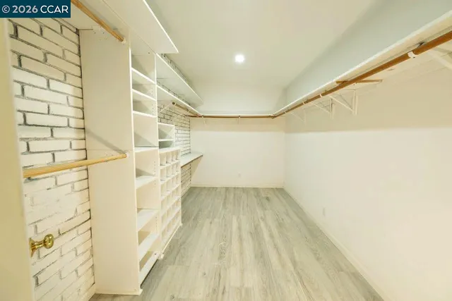 a view of a bathroom with a sink and a shower