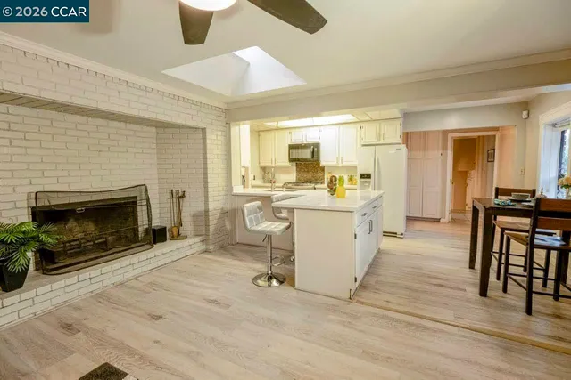 a view of a kitchen with furniture and a fireplace