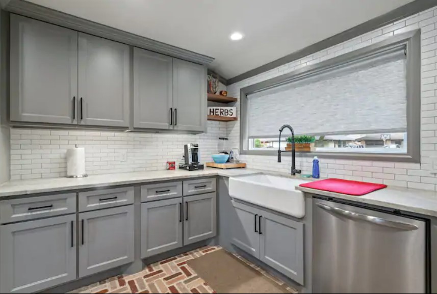 4709 Lido Lane Houston, TX 77092 - Photo 3 of 19 a kitchen with a sink stove and cabinets