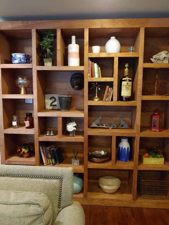 4709 Lido Lane Houston, TX 77092 - Photo 7 of 19 a living room with a bookshelf and a shelf with books and dining room