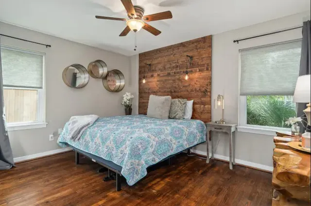 a bedroom with a bed and a window