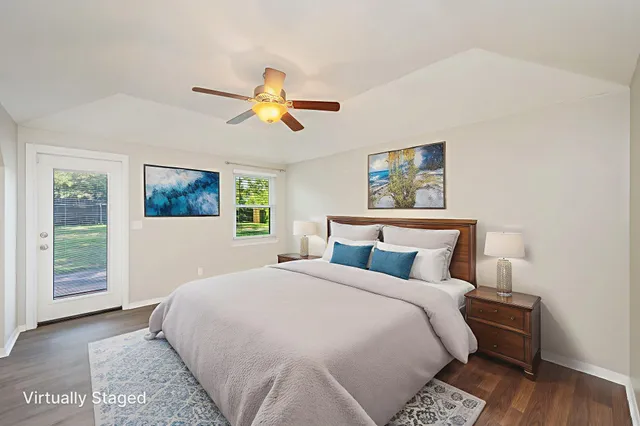 a bedroom with a large bed and a window