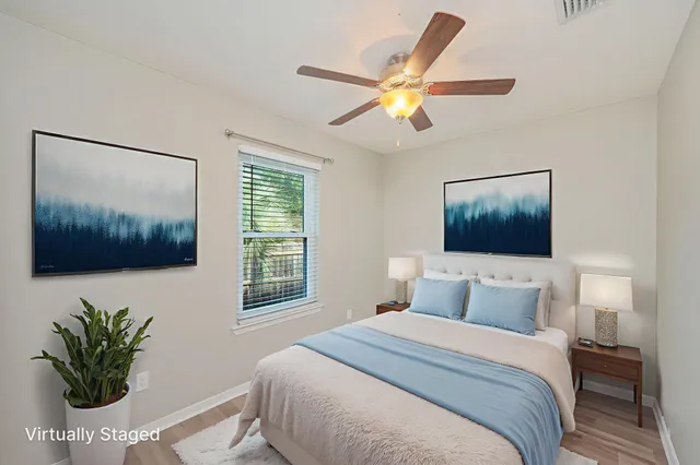 a bedroom with a large bed and a window