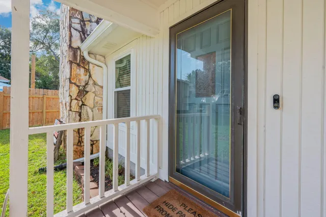 a view of a balcony with wooden floor