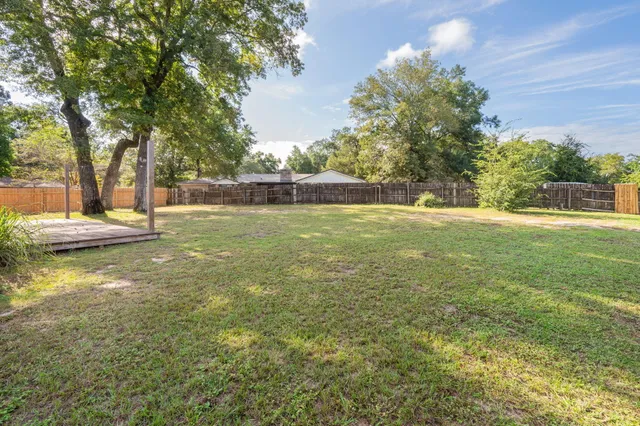 a view of a water fountain and a big yard
