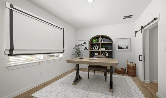 a view of a workspace with furniture