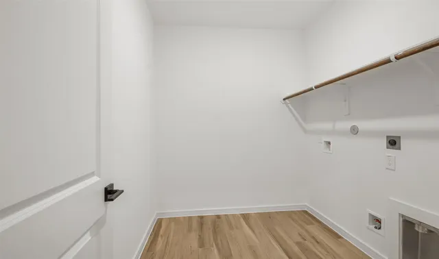 a view of a street with an ocean view