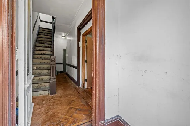 a living room with furniture a window and a chandelier