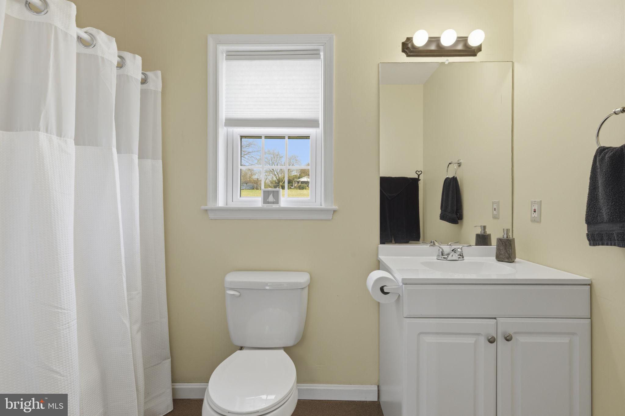 3831 Wilkinson Road Havre de Grace, MD 21078 - Photo 28 of 51 a bathroom with a toilet sink and mirror