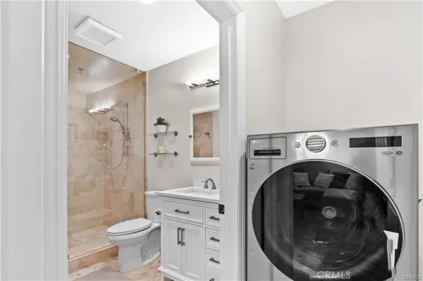 a bathroom with a toilet and a sink