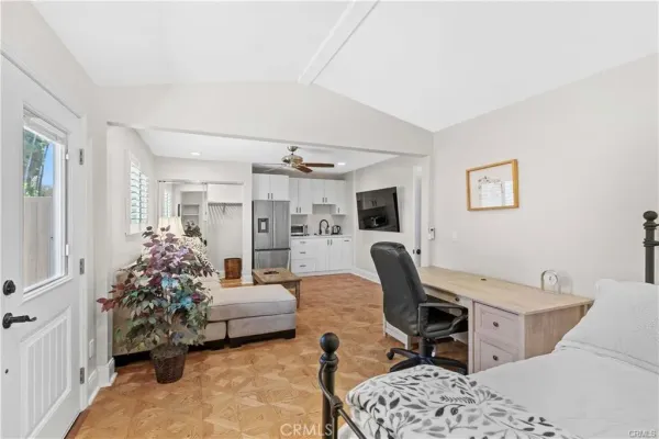 a view of a livingroom with furniture and a flat screen tv