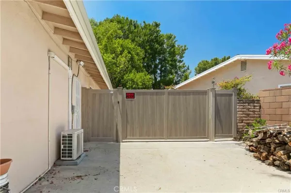 a view of a wooden door with a tree