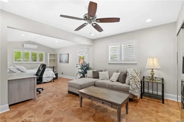 a living room with furniture and a window