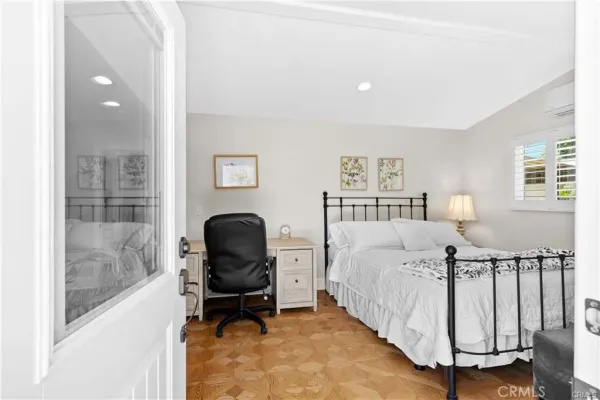 a bed room with a bed and glass window