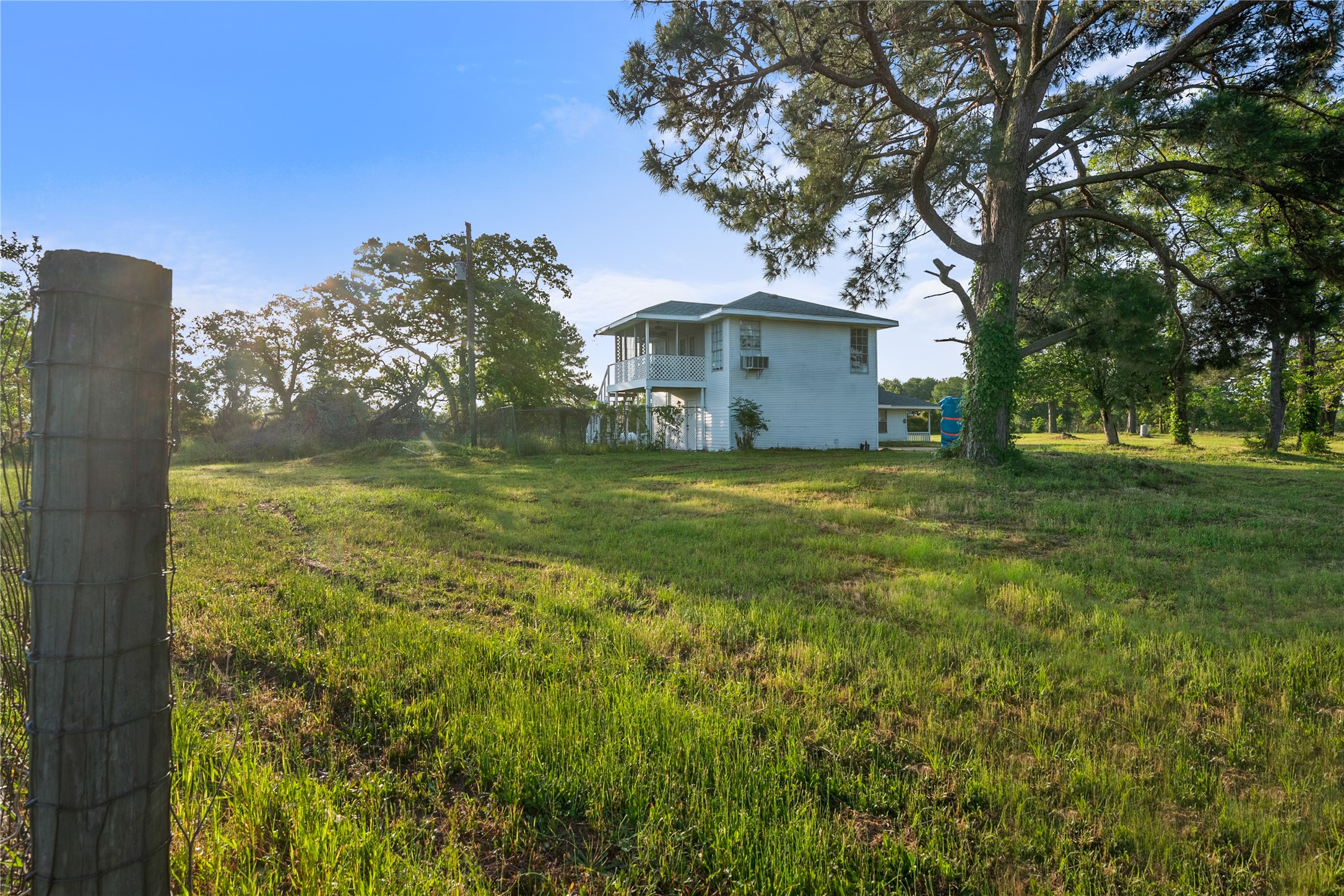 36622 Tompkins Road Hempstead, TX 77445 - Photo 14 of 46 a view of a house with a big yard