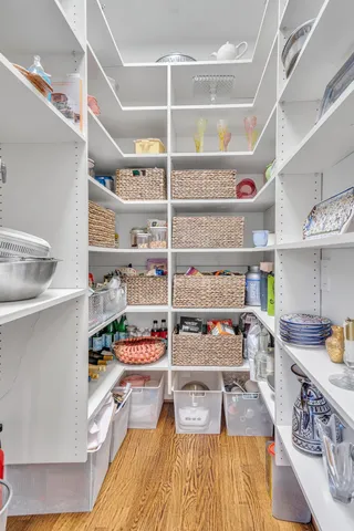 a kitchen with stainless steel appliances granite countertop a sink and wooden cabinets