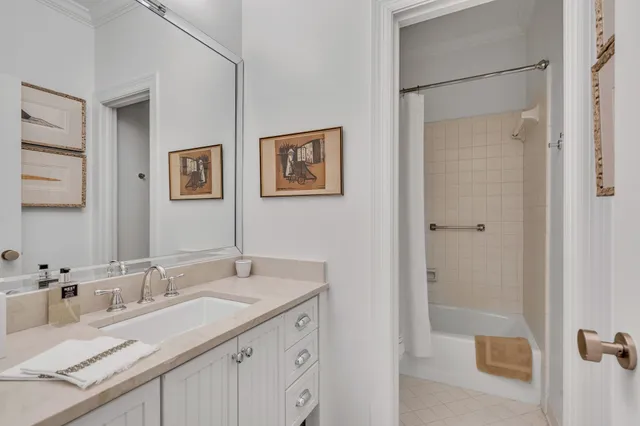 a bathroom with a granite countertop sink mirror and double