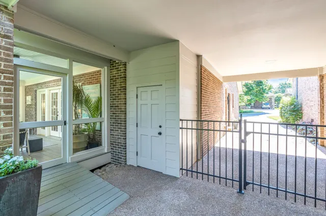 a view of a balcony with wooden floor