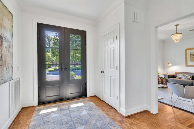 a view of an entryway with wooden floor
