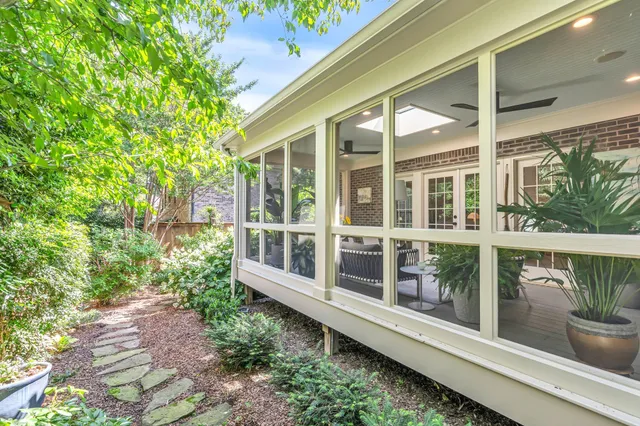 a view of a balcony with potted plants