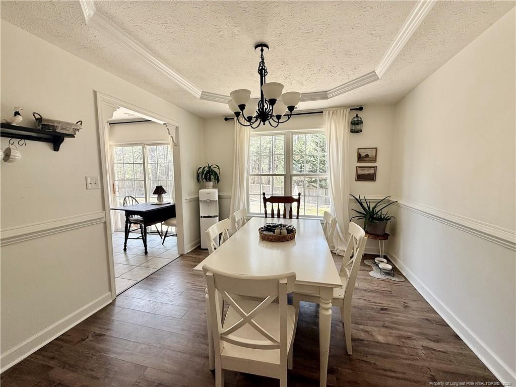 234 Pender Road Spring Lake, NC 28390 - Photo 10 of 39 a view of a dining room with furniture window and wooden floor