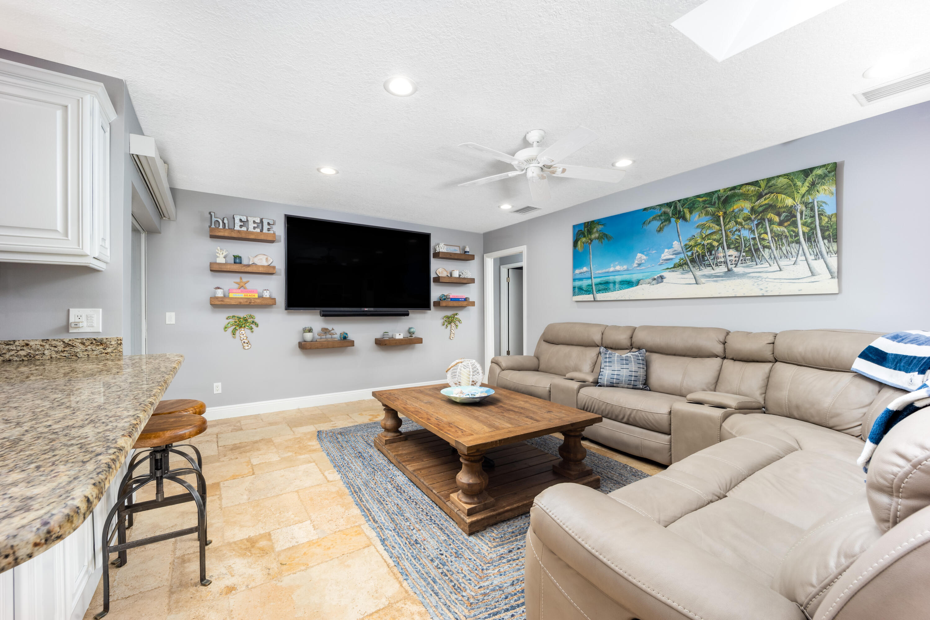 3771 Southeast Fairway West Stuart, FL 34997 - Photo 18 of 41 a living room with furniture and a flat screen tv