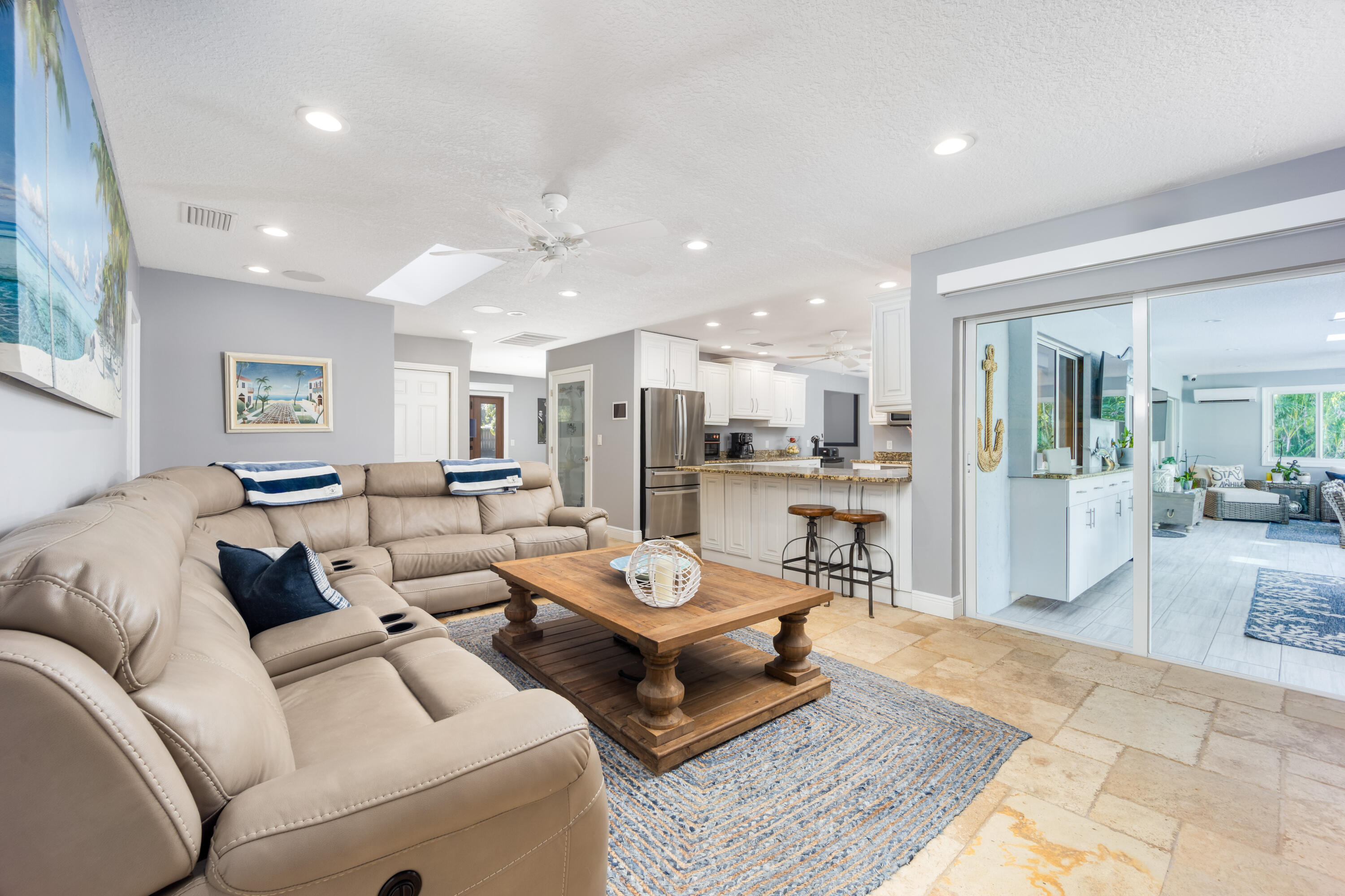 3771 Southeast Fairway West Stuart, FL 34997 - Photo 19 of 41 a living room with furniture and a table