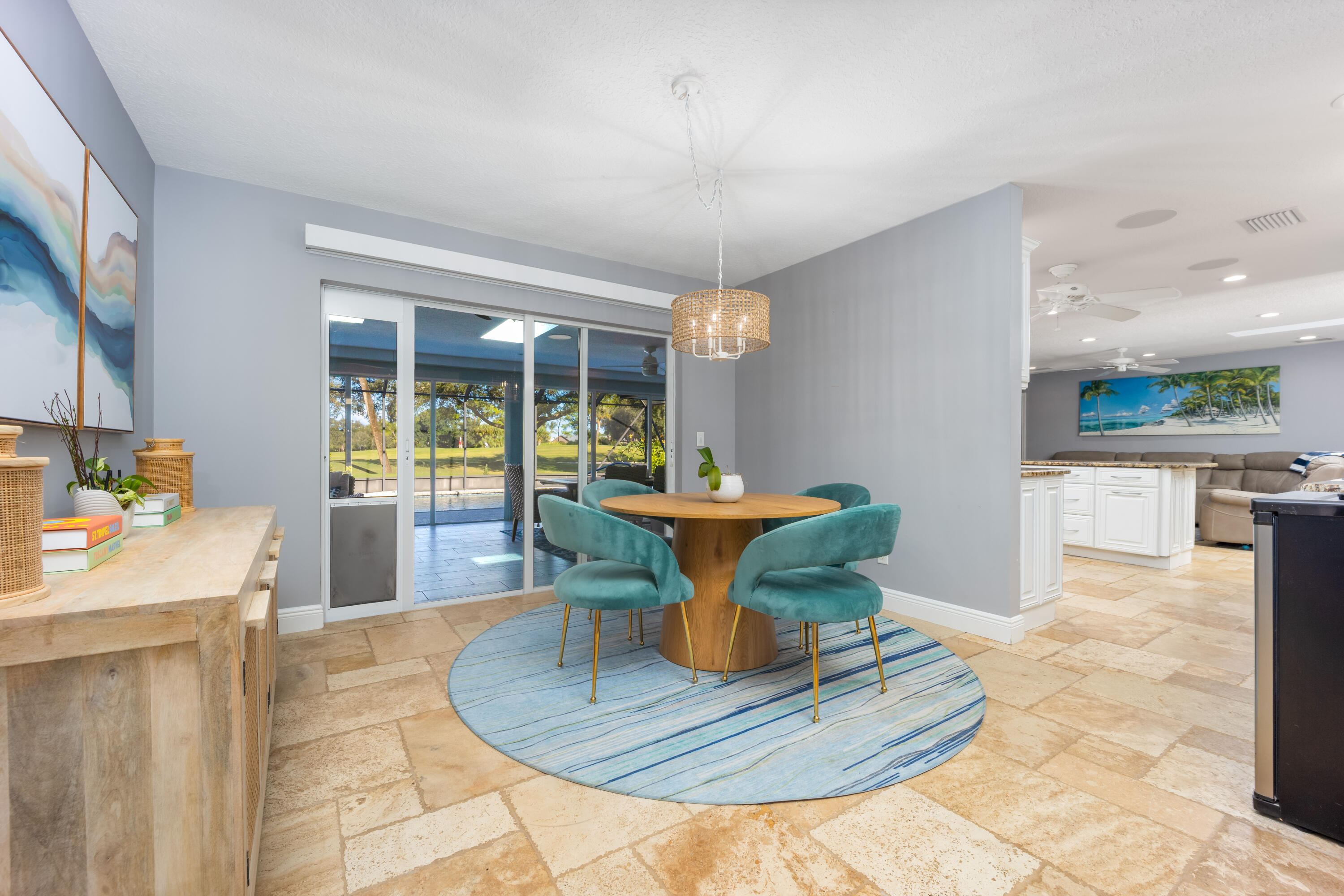3771 Southeast Fairway West Stuart, FL 34997 - Photo 22 of 41 a view of a living room and kitchen with furniture