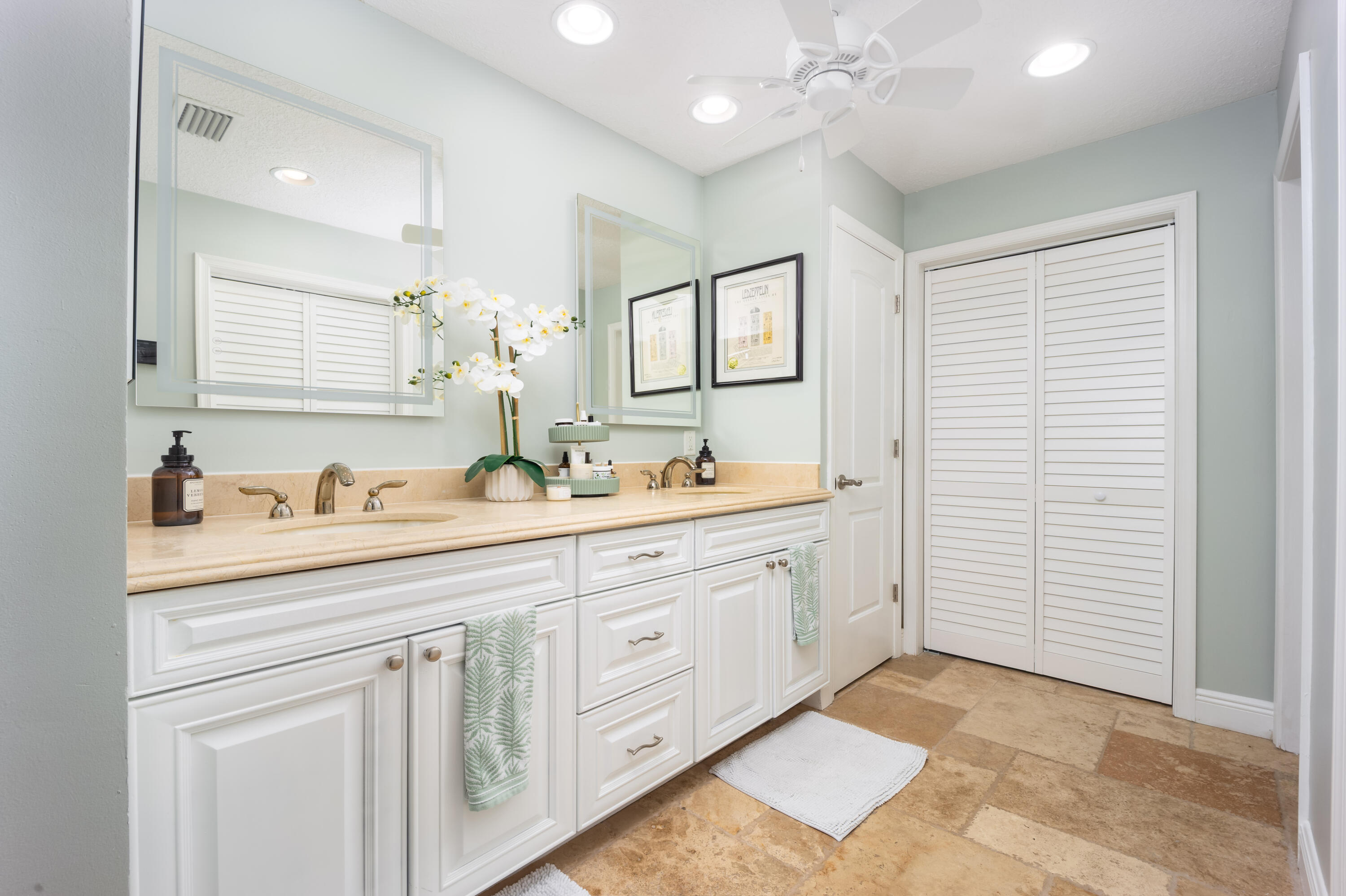 3771 Southeast Fairway West Stuart, FL 34997 - Photo 25 of 41 a spacious bathroom with a double vanity sink mirror and