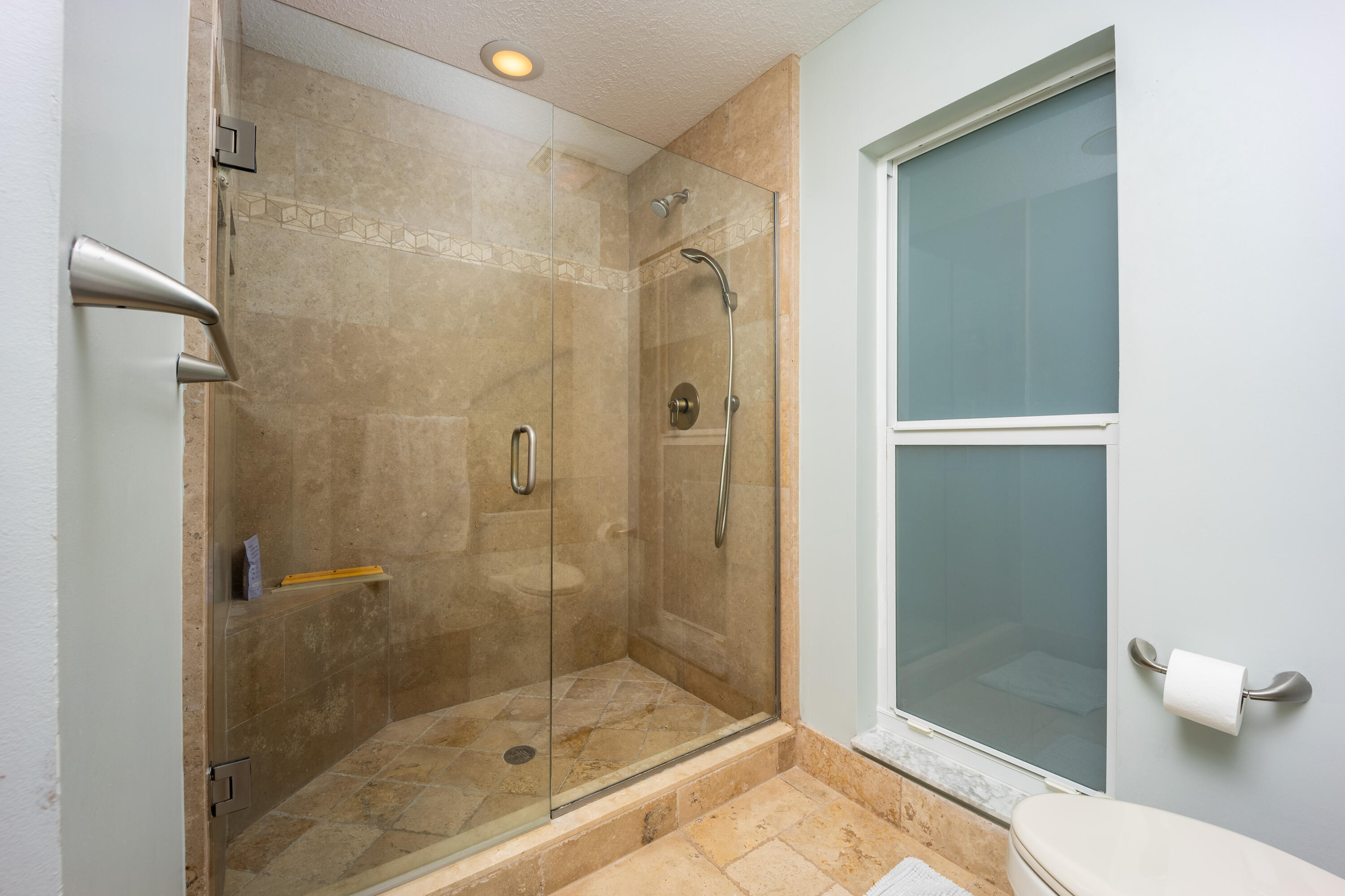 3771 Southeast Fairway West Stuart, FL 34997 - Photo 26 of 41 a bathroom with a shower and a toilet