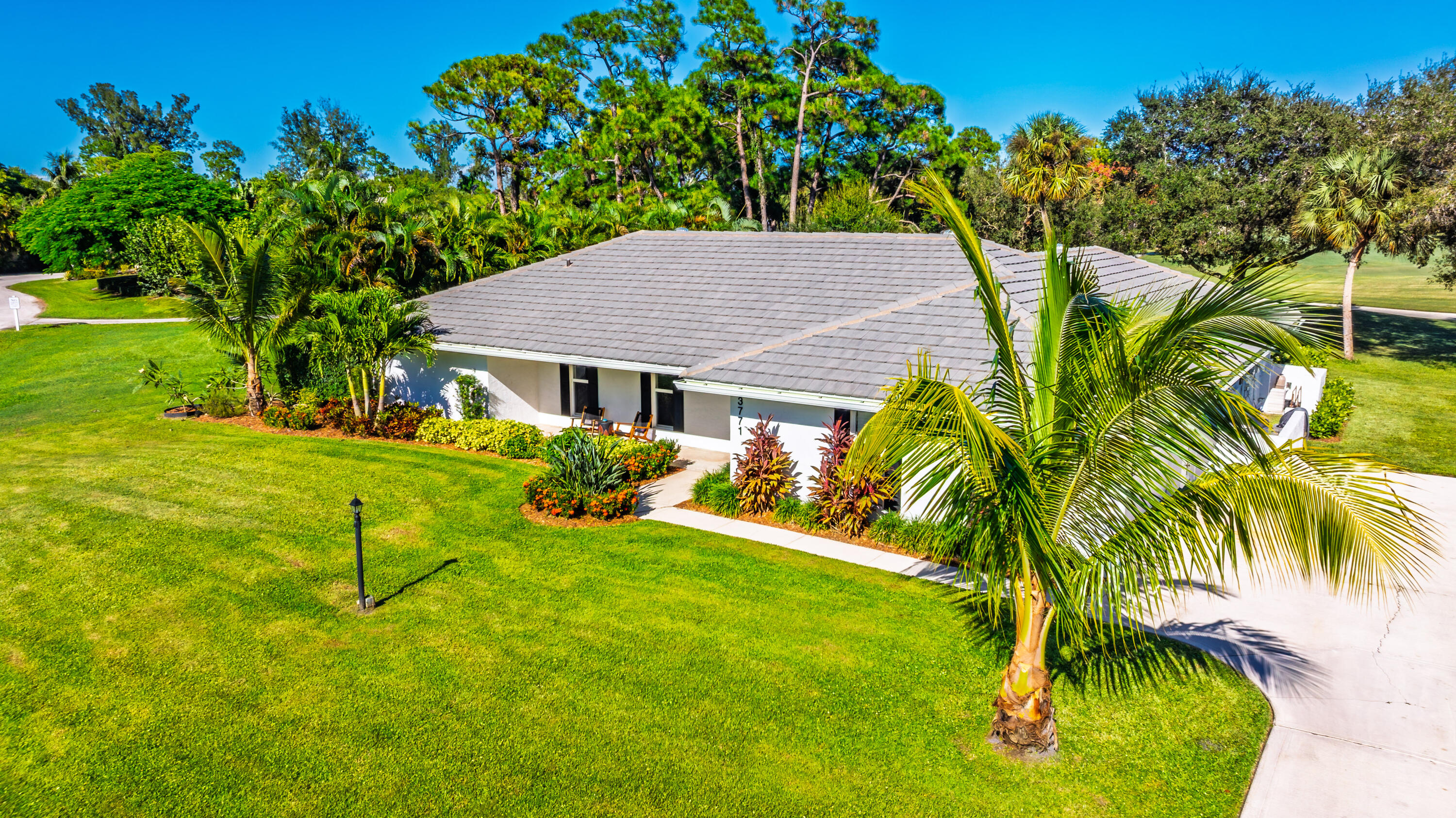 3771 Southeast Fairway West Stuart, FL 34997 - Photo 3 of 41 a view of a house with a backyard