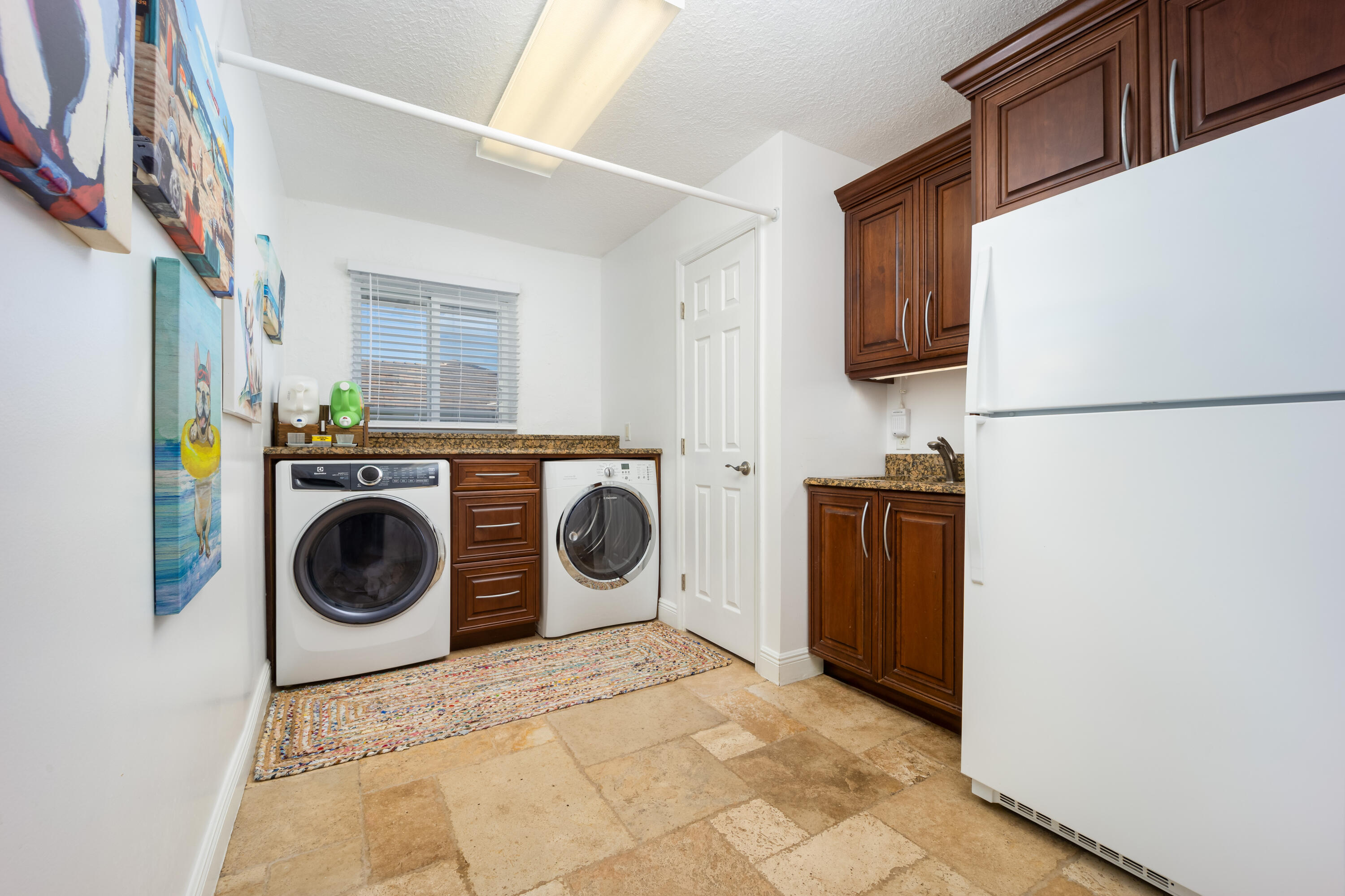 3771 Southeast Fairway West Stuart, FL 34997 - Photo 32 of 41 a utility room with dryer and washer
