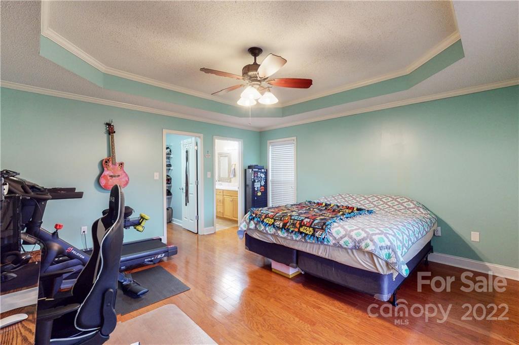 261 Pitts Road Catawba, SC 29704 - Photo 26 of 43 a bedroom with bed and a chandelier