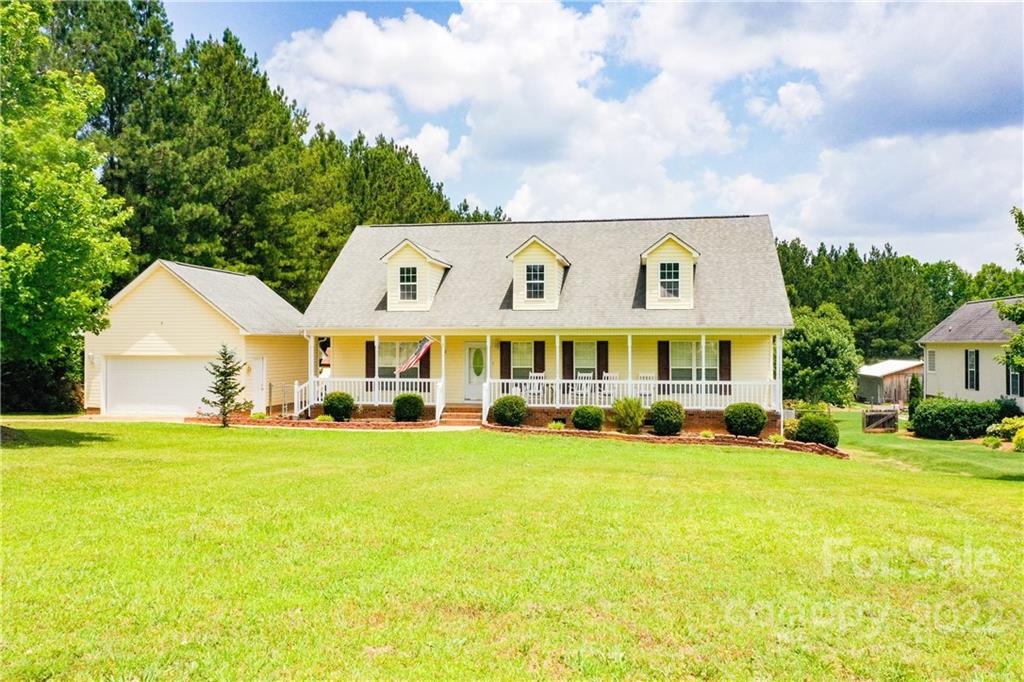 261 Pitts Road Catawba, SC 29704 - Photo 3 of 43 a view of a house with a big yard and large trees