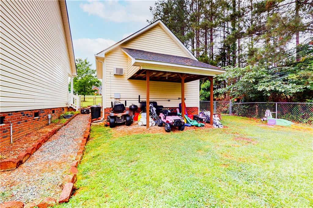 261 Pitts Road Catawba, SC 29704 - Photo 34 of 43 a view of a house with backyard and sitting area