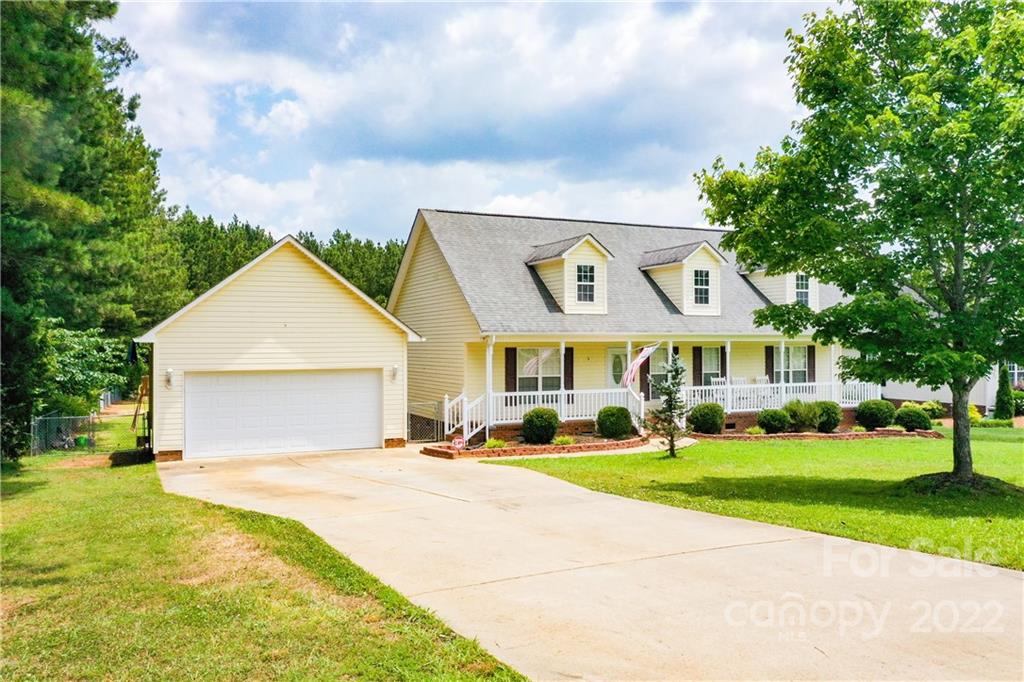 261 Pitts Road Catawba, SC 29704 - Photo 4 of 43 a view of a house with a big yard and large trees