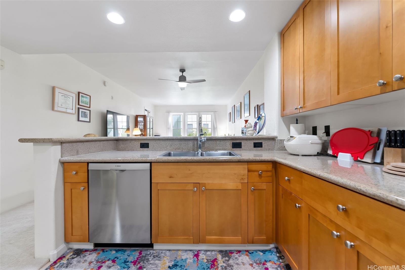 520 Lunalilo Home Road, Unit 7216 Honolulu, HI 96825 - Photo 5 of 24 a kitchen with stainless steel appliances granite countertop a sink stove and cabinets