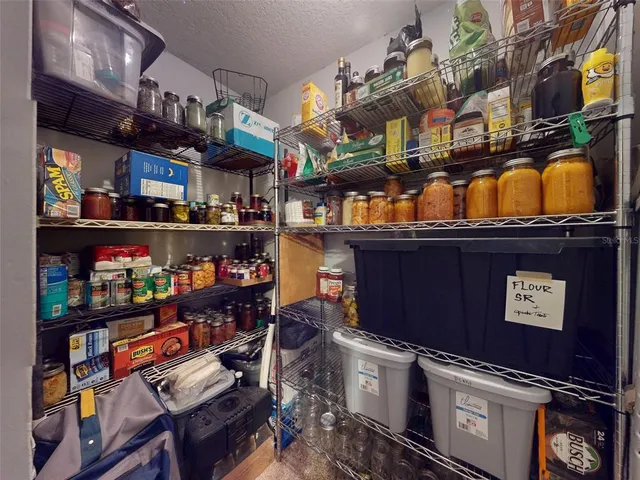 a view of a house with a yard and a garage