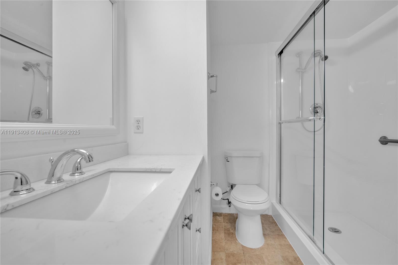 2048 Hythe A, Unit 2048 Boca Raton, FL 33434 - Photo 8 of 25 a bathroom with a sink toilet and shower