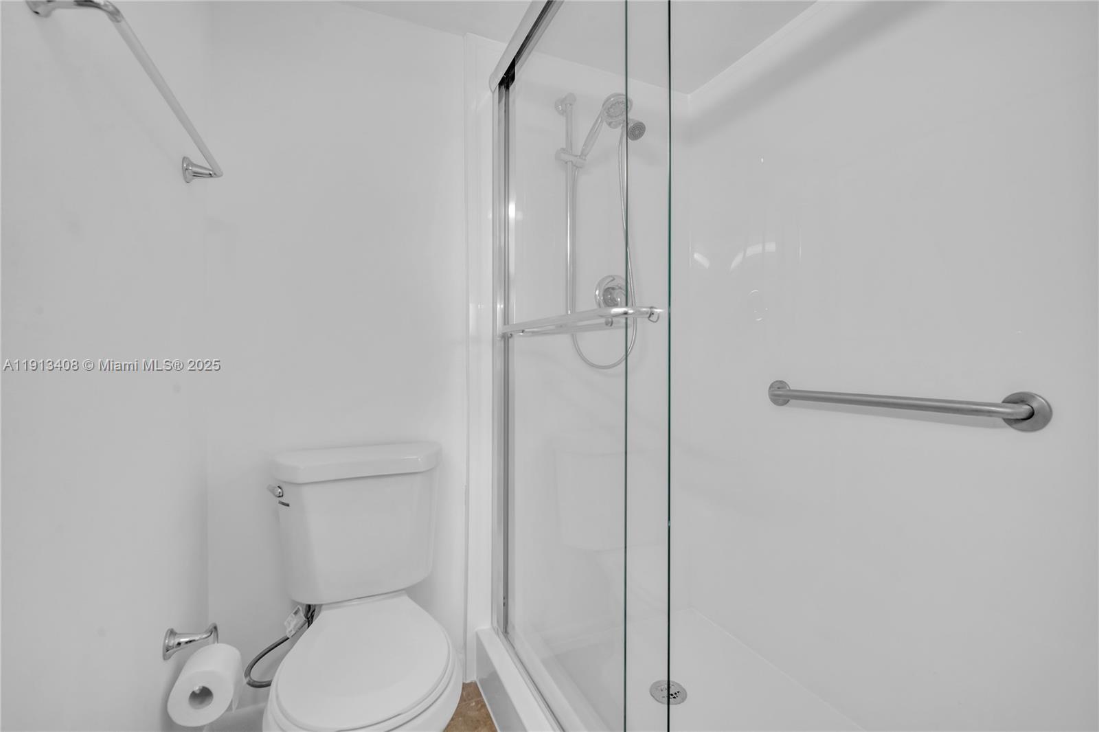 2048 Hythe A, Unit 2048 Boca Raton, FL 33434 - Photo 9 of 25 a white toilet sitting next to a shower