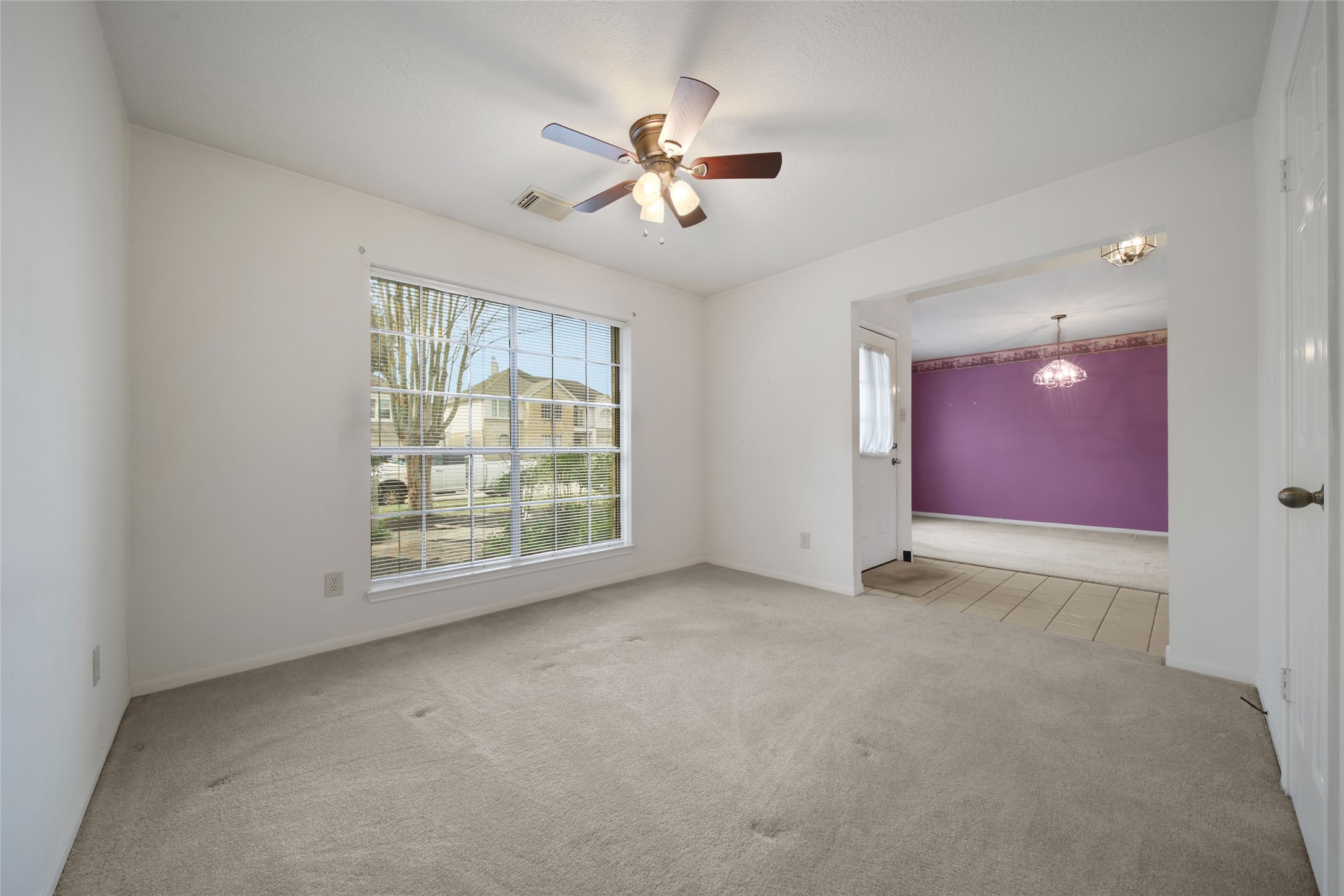 19110 Timber Way Drive Humble, TX 77346 - Photo 13 of 24 an empty room with windows and fan