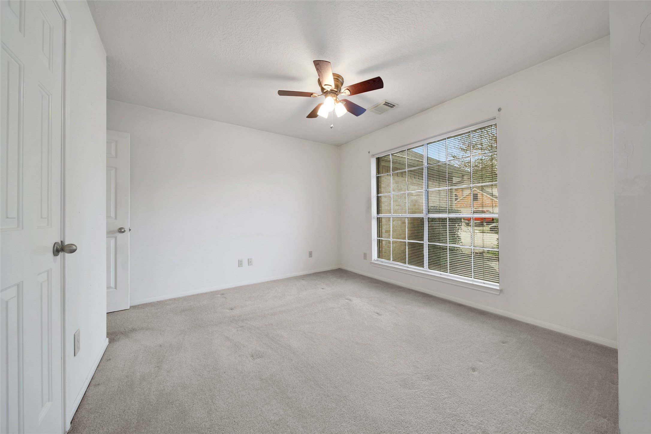 19110 Timber Way Drive Humble, TX 77346 - Photo 14 of 24 a view of an empty room with a window