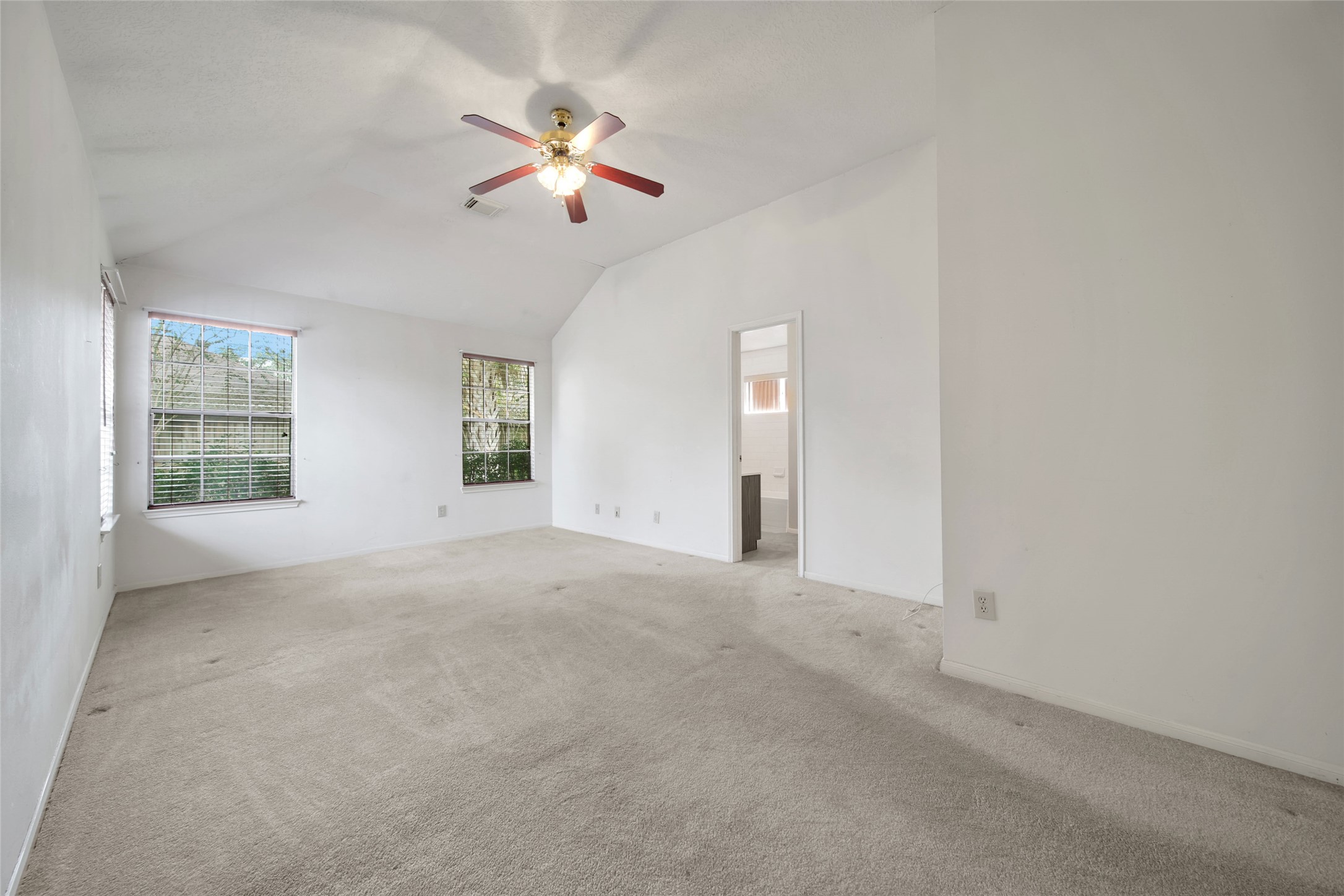19110 Timber Way Drive Humble, TX 77346 - Photo 15 of 24 an empty room with windows and fan