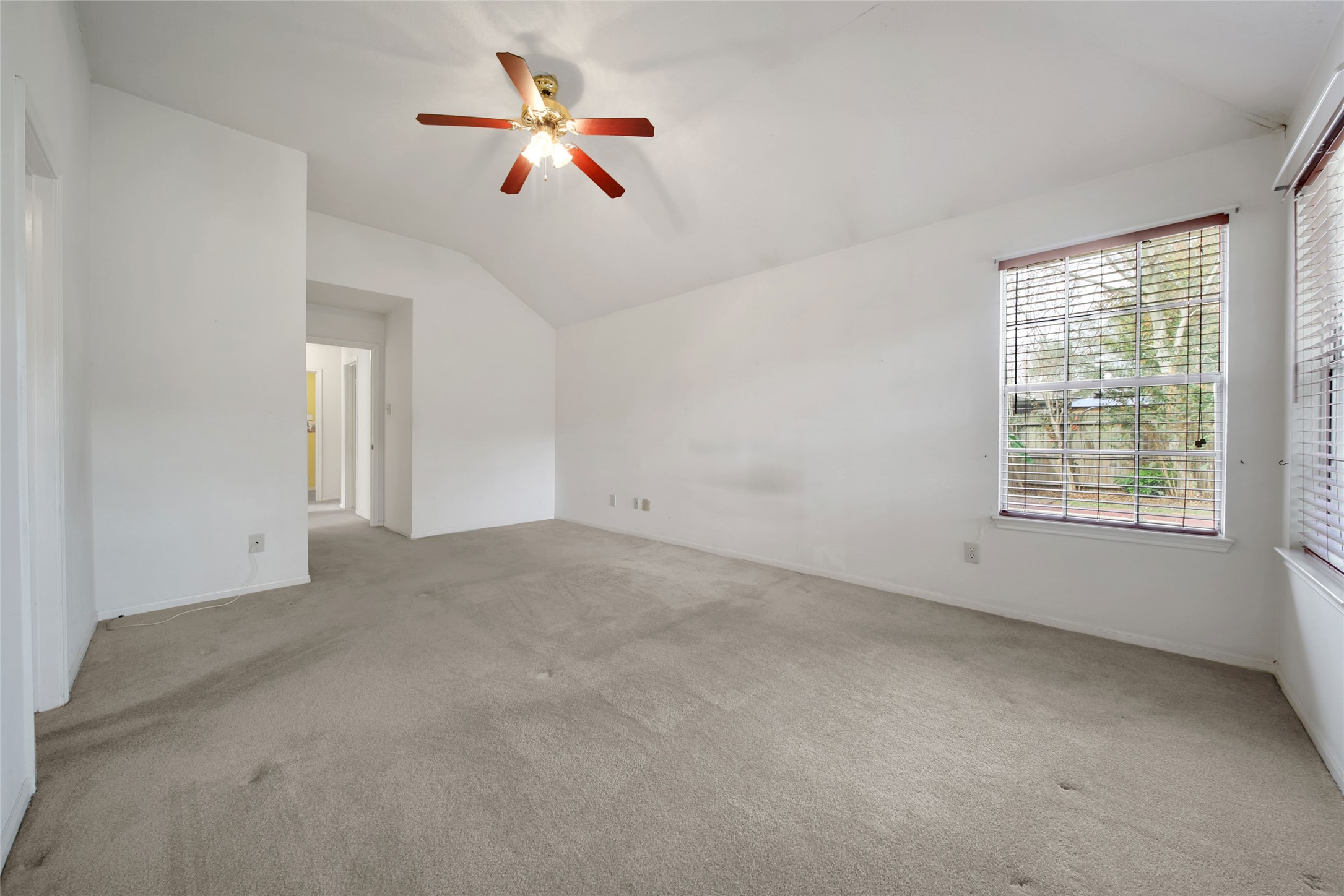 19110 Timber Way Drive Humble, TX 77346 - Photo 16 of 24 an empty room with ceiling fan and window